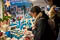 Friend perusing handmade mugs at Deák Ferenc Christmas market.